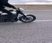 This professional stunt rider showed off a mind-blowing daredevil act on his motorbike. He started by riding the bike while facing backward. Eventually, he turned, stood on it, and balanced himself on top of the moving vehicle before attempting a wheelie and finishing the stunt.&#60;br/&#62;&#60;br/&#62;“The underlying music rights are not available for license. For use of the video with the track(s) contained therein, please contact the music publisher(s) or relevant rightsholder(s).”